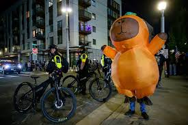 Peaceful Protest Near Willamette River Features Inflatable Costumes to Raise Awareness Outside ICE Center